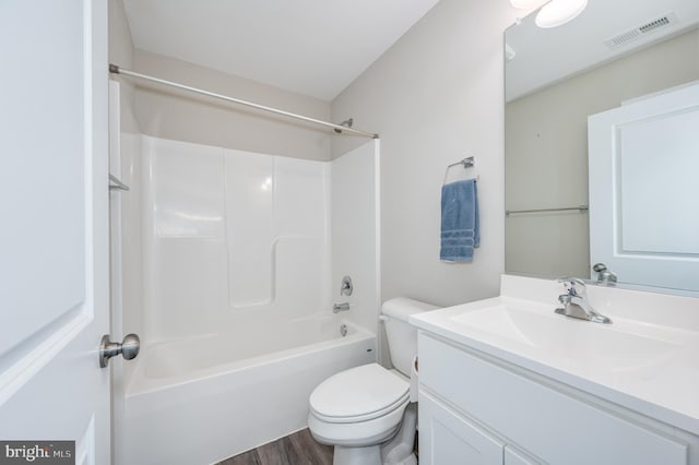 full bathroom with toilet, vanity, shower / washtub combination, and hardwood / wood-style floors