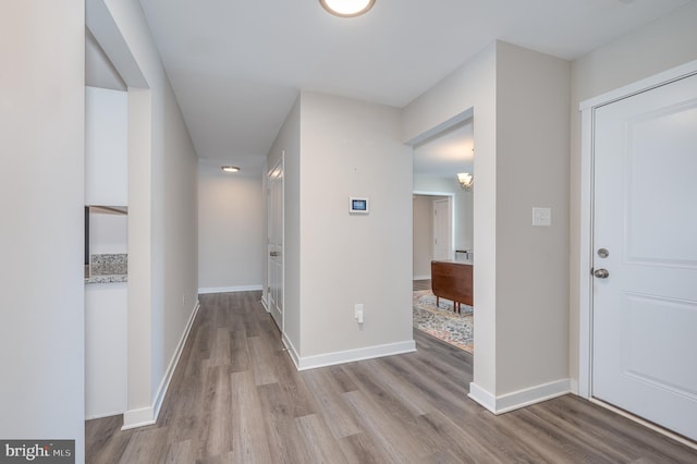 corridor featuring light wood-type flooring