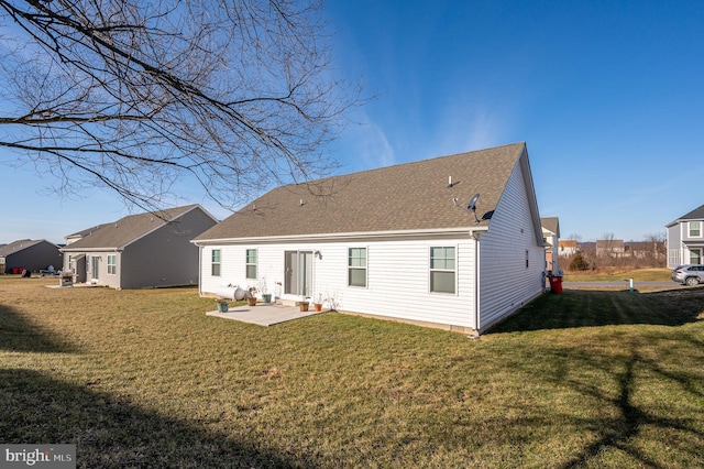 back of house featuring a patio area and a yard