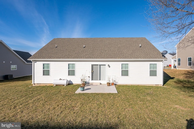 back of property with central air condition unit, a yard, and a patio