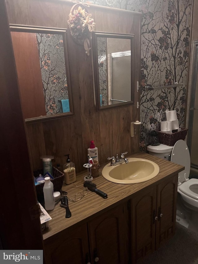 bathroom featuring toilet and vanity