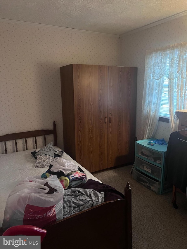 carpeted bedroom with a textured ceiling