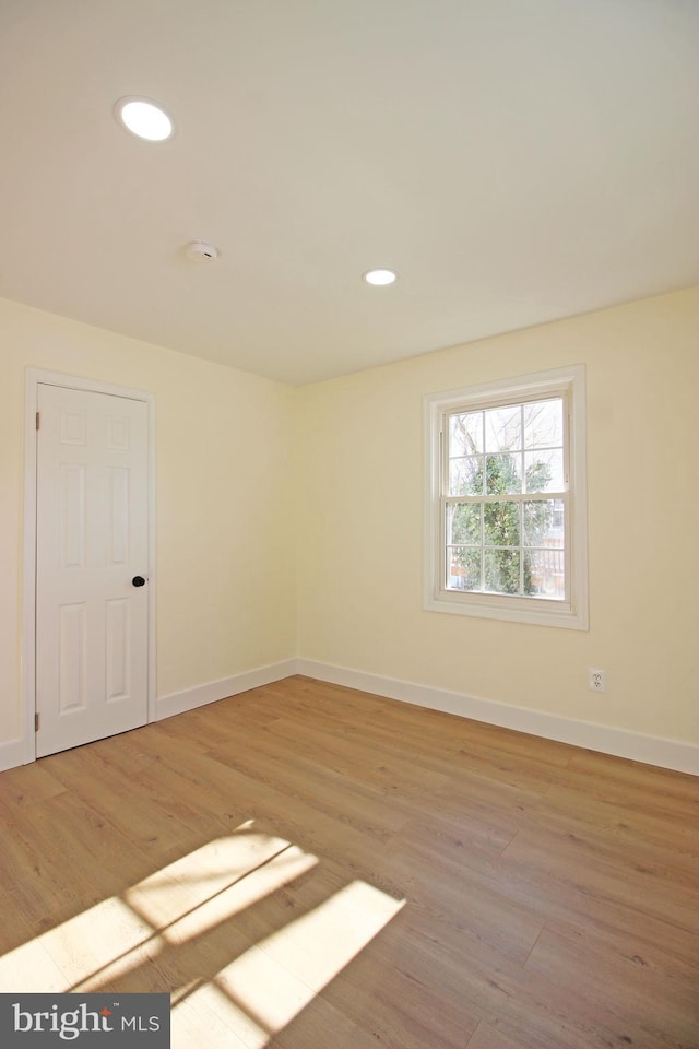 unfurnished room featuring light hardwood / wood-style flooring