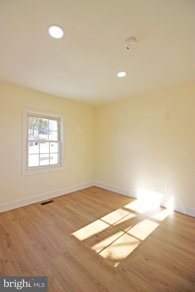 unfurnished room featuring light hardwood / wood-style floors