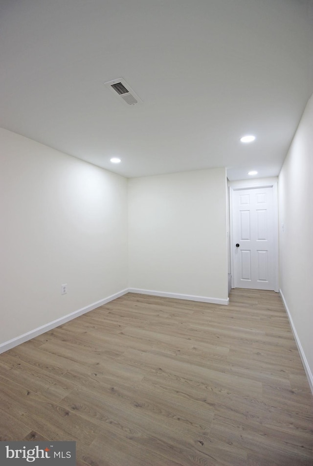 unfurnished room with light hardwood / wood-style floors