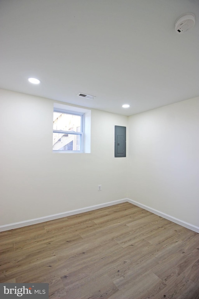 interior space with hardwood / wood-style floors and electric panel