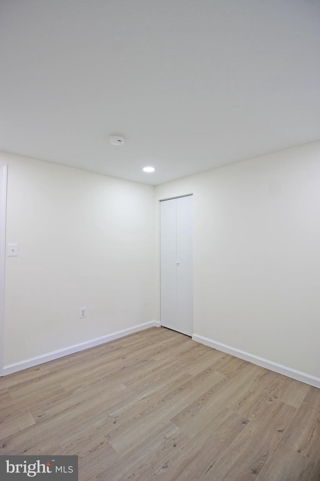 spare room with light wood-type flooring