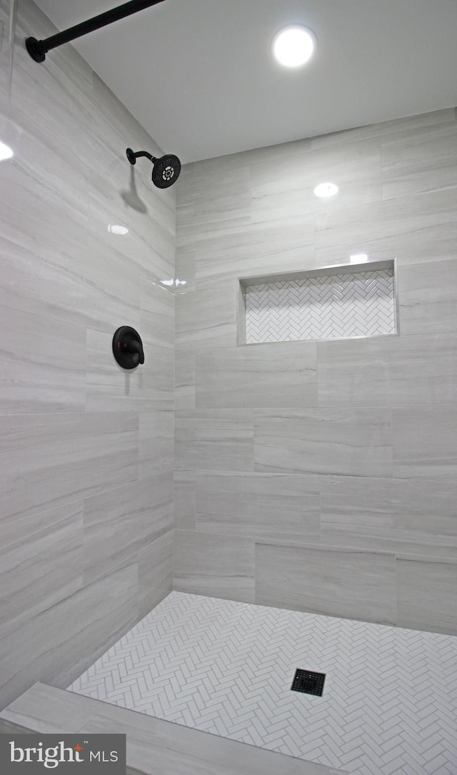 bathroom with a tile shower