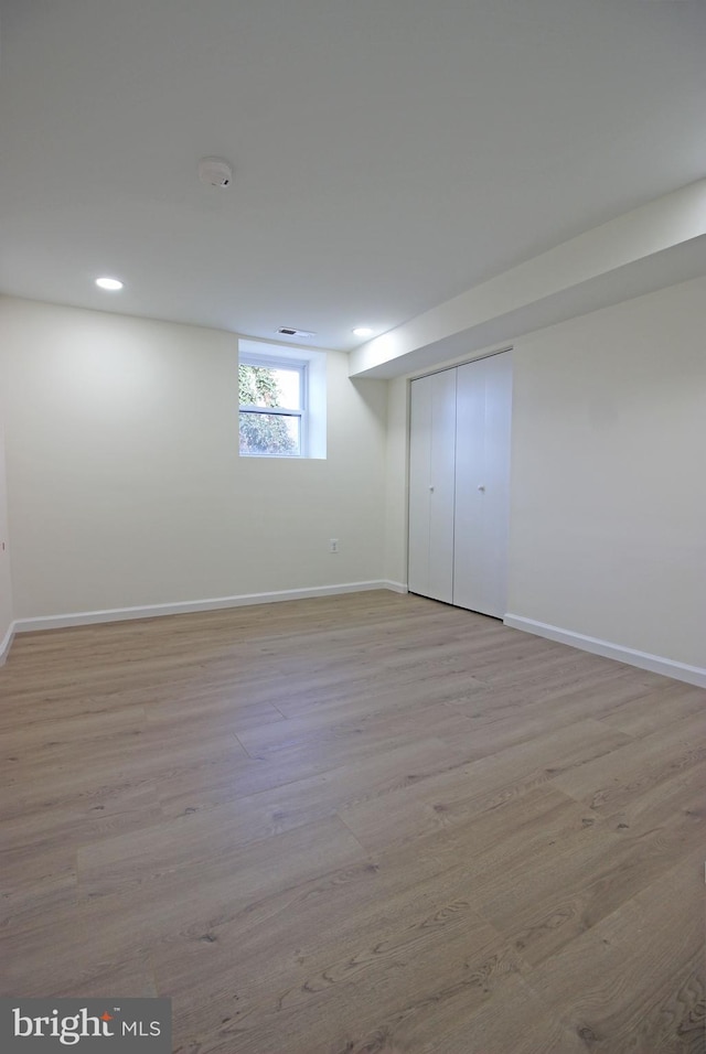 basement featuring light hardwood / wood-style floors