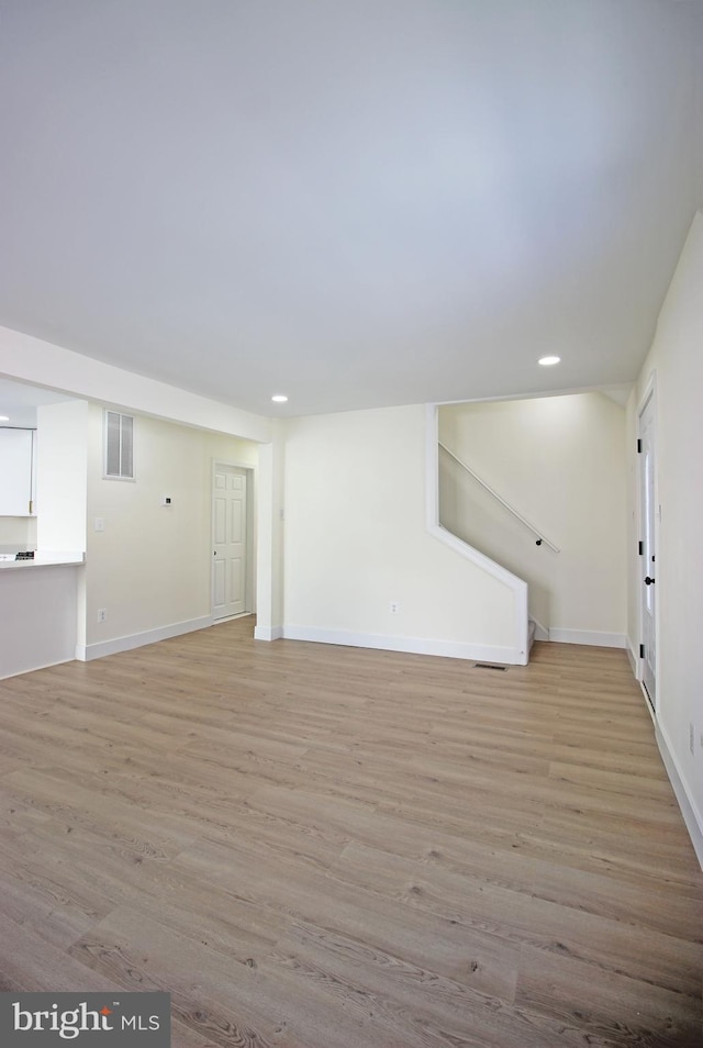 unfurnished living room featuring light wood-type flooring