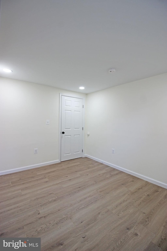 unfurnished room featuring light wood-type flooring