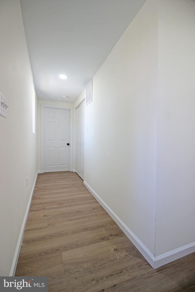 corridor featuring light hardwood / wood-style floors