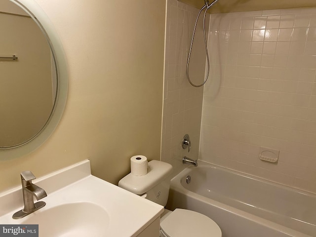 full bathroom with toilet, tiled shower / bath combo, and sink