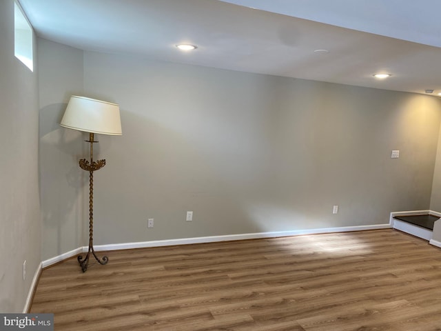 empty room with hardwood / wood-style flooring