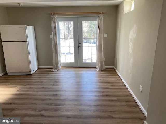 doorway featuring dark wood-type flooring and french doors