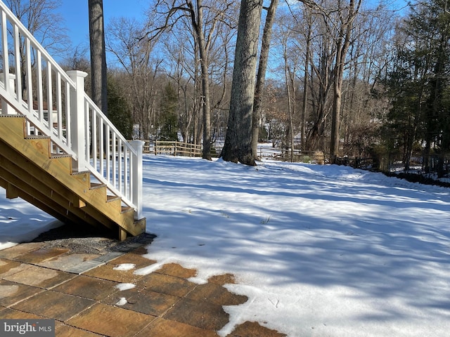 view of yard layered in snow