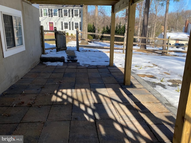 view of snow covered patio