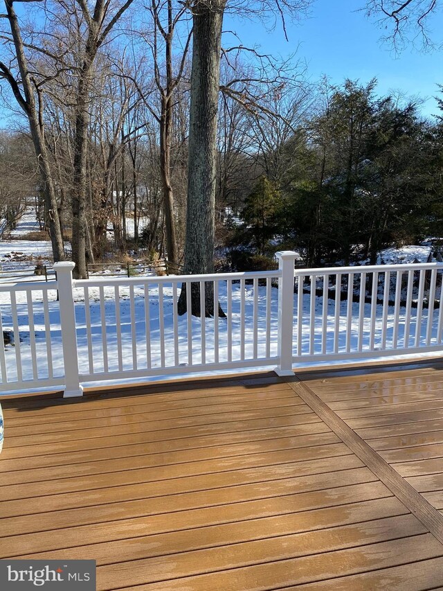 view of snow covered deck