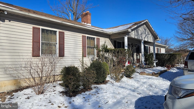 view of snow covered property