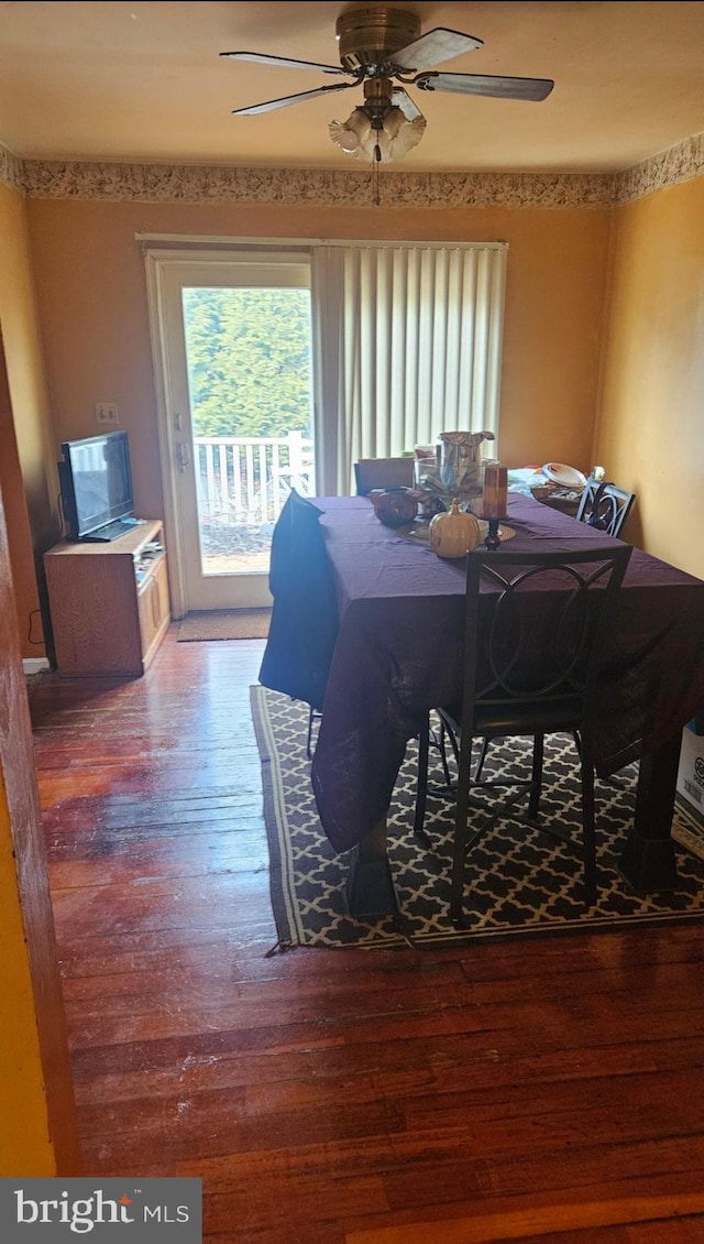 dining space featuring hardwood / wood-style floors and ceiling fan