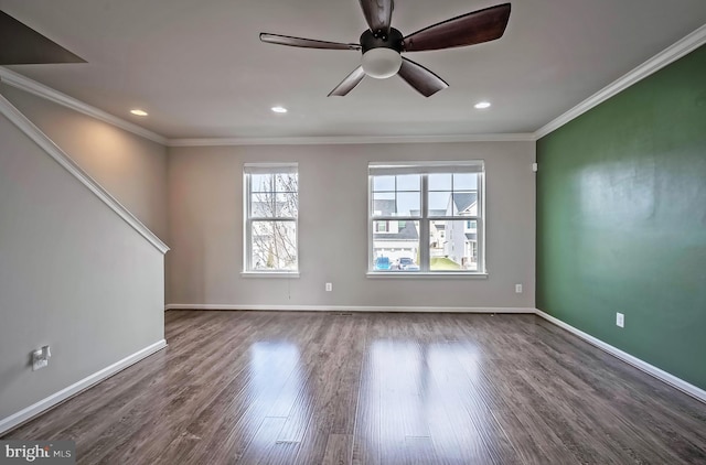 spare room featuring ceiling fan, wood-type flooring, and crown molding