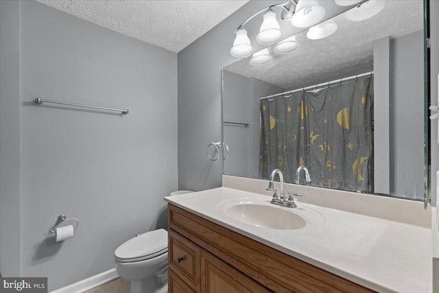 bathroom featuring toilet, a textured ceiling, a shower with curtain, and vanity