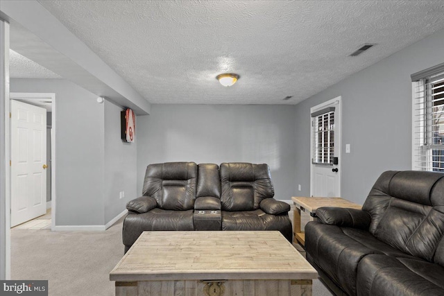 living room with light colored carpet and a textured ceiling