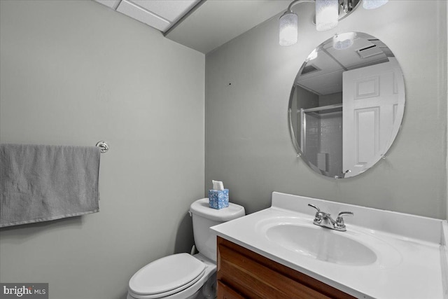 bathroom featuring toilet and vanity