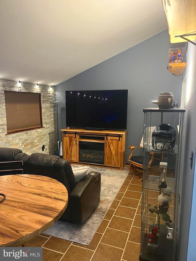 living room with a stone fireplace