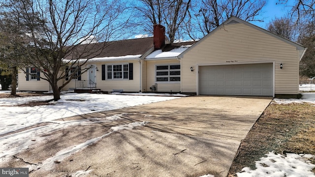 ranch-style house featuring a garage