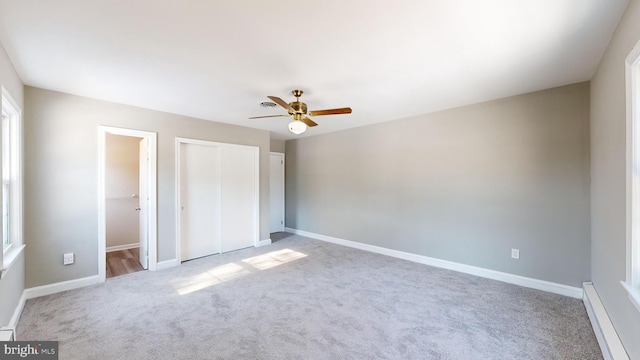 unfurnished bedroom featuring light carpet and ceiling fan