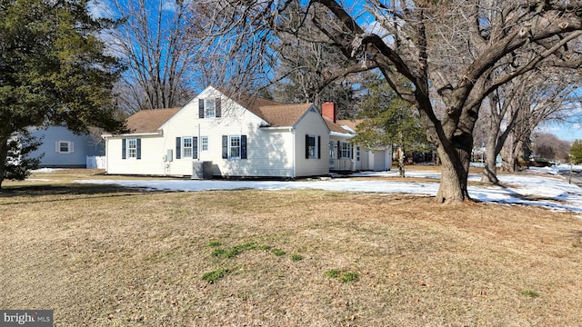 view of side of property with a yard