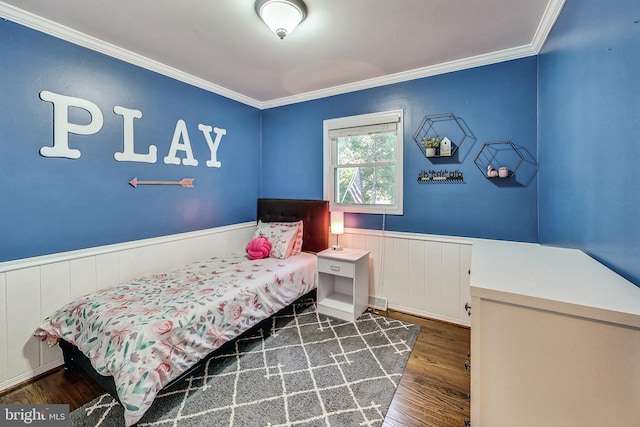 bedroom featuring dark hardwood / wood-style flooring and crown molding