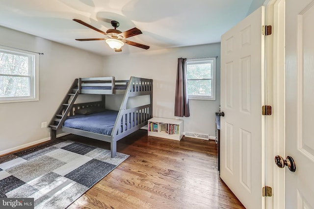 bedroom featuring ceiling fan and hardwood / wood-style flooring