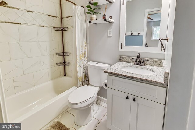 full bathroom with tile patterned floors, toilet, vanity, and shower / bath combo