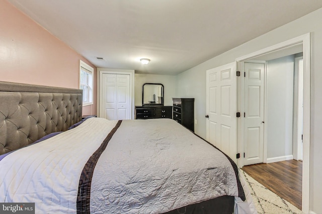 bedroom with wood-type flooring