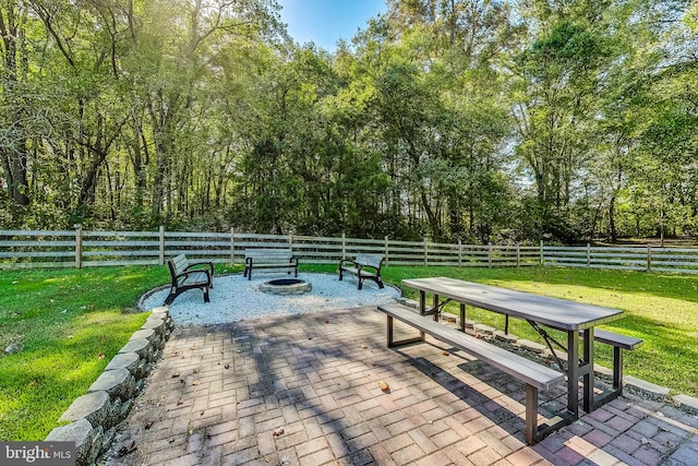 view of property's community with a patio area and a yard