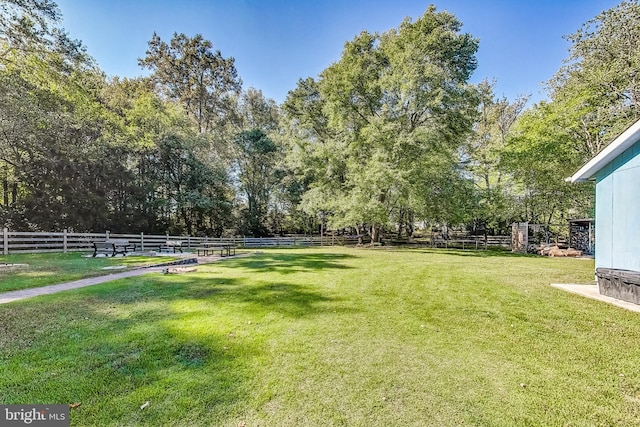 view of yard with a rural view