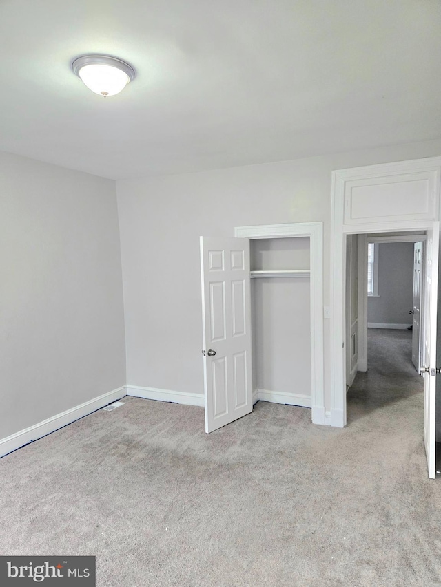 unfurnished bedroom featuring a closet