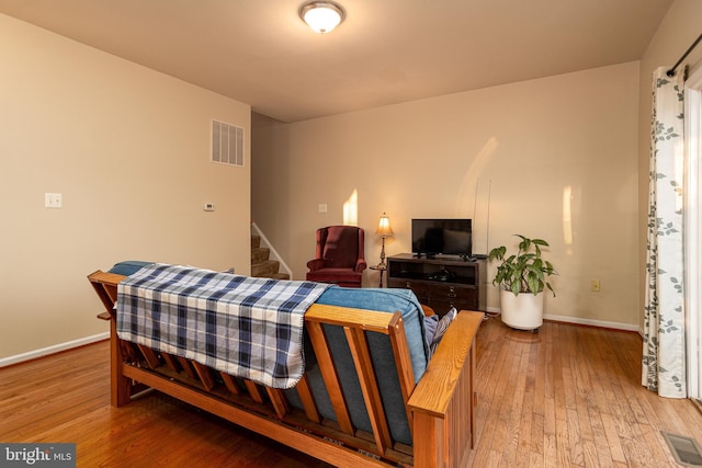 bedroom with hardwood / wood-style floors