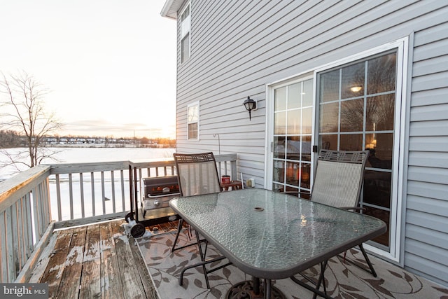 snow covered deck featuring area for grilling