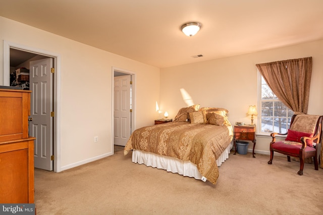 bedroom featuring light carpet