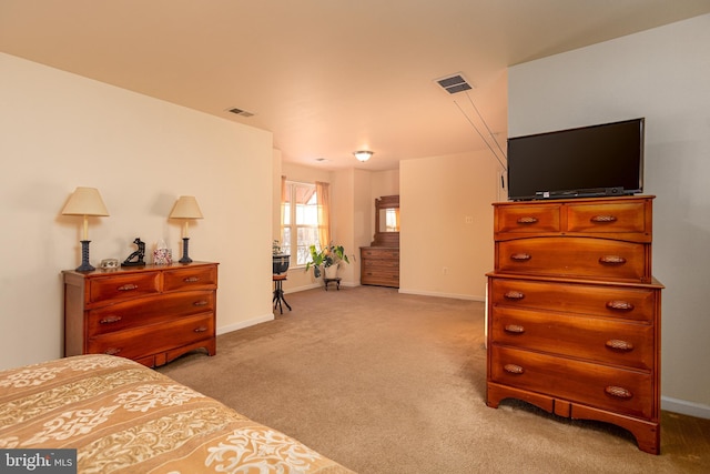 bedroom with light colored carpet