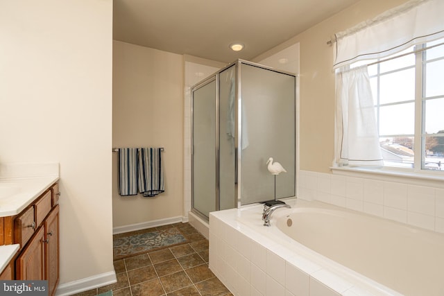 bathroom with plus walk in shower and vanity