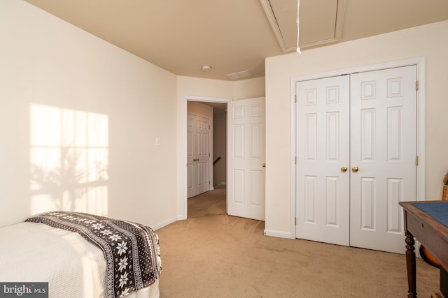 bedroom with carpet and a closet