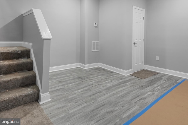 foyer with light hardwood / wood-style floors