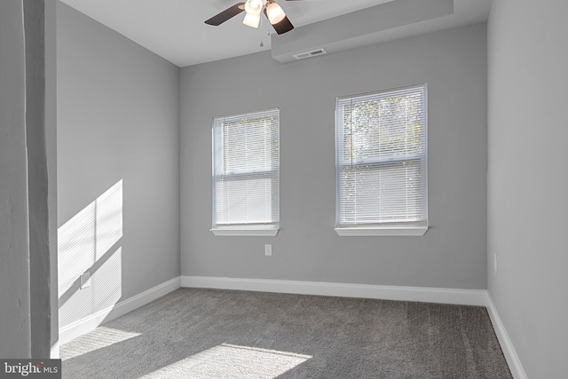 carpeted spare room with ceiling fan