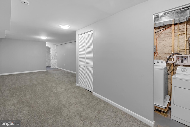 basement with carpet flooring and washing machine and clothes dryer