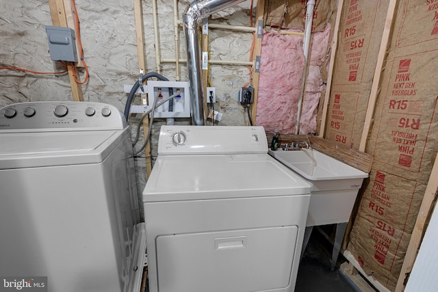 laundry room with washer and dryer and sink