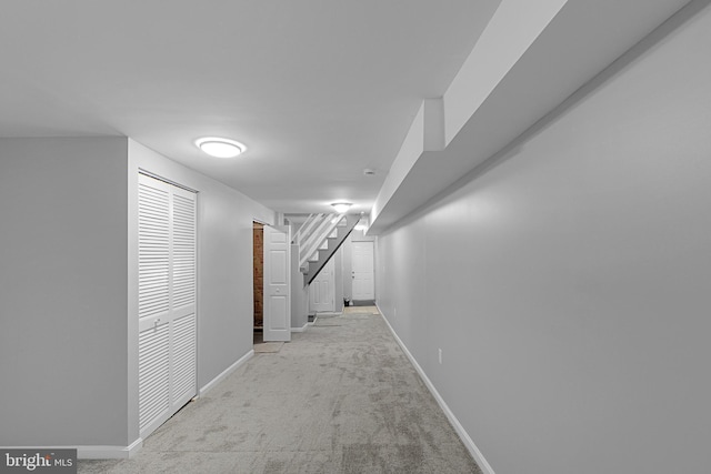 hallway featuring light carpet